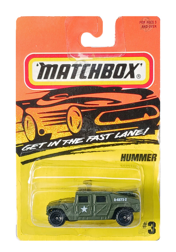 Matchbox Hummer toy vehicle in packaging with orange and yellow background